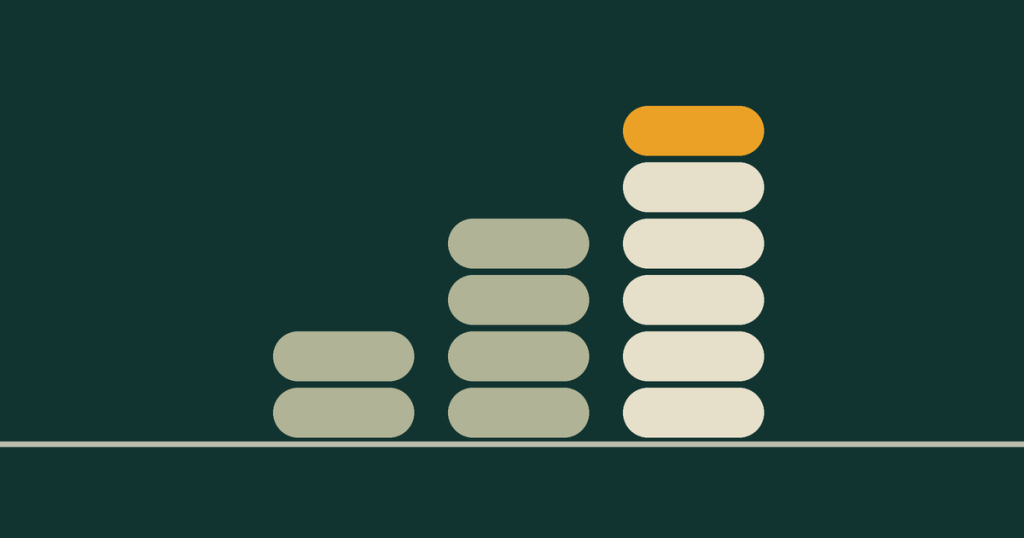 Three stacks of coins stepping up in height, the top coin of the tallest in dawn gold.