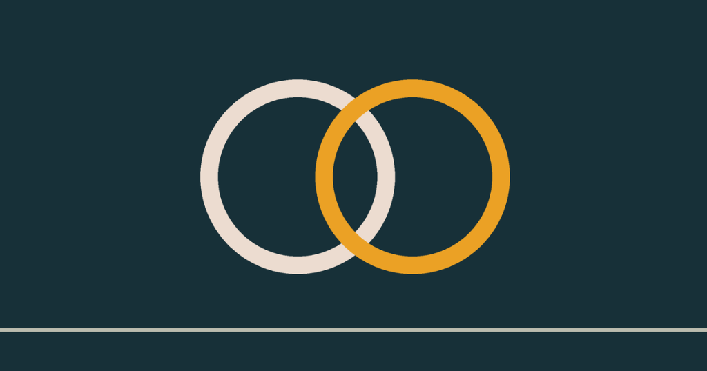 Two complete interlocking rings, one pale and one dawn gold.